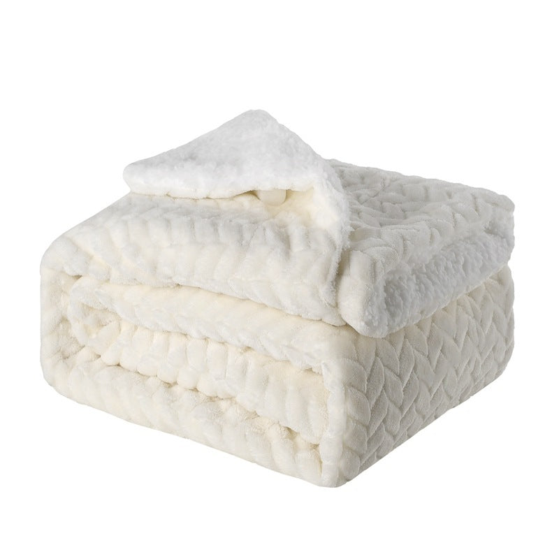 Thick sherpa fleece throw on a sofa