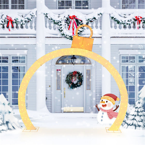 Lighted Christmas ornament archway at night