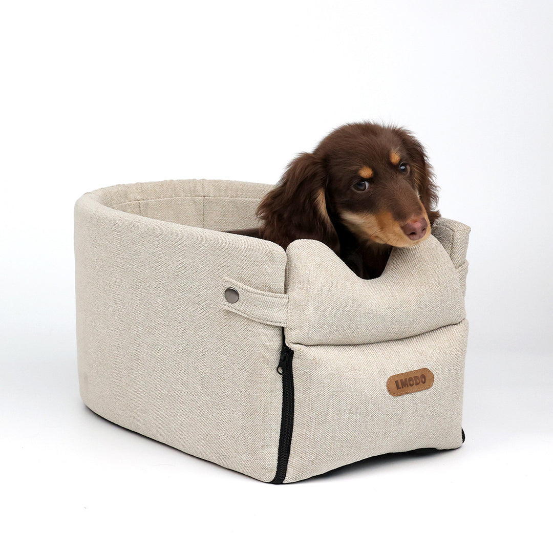 Small dog in armrest car seat bed