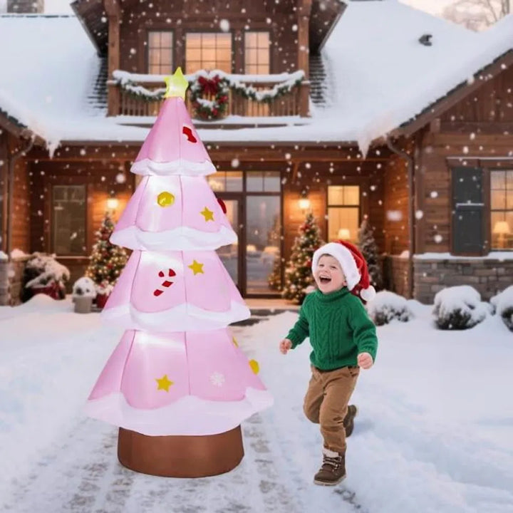 Giant pink inflatable Christmas tree glowing
