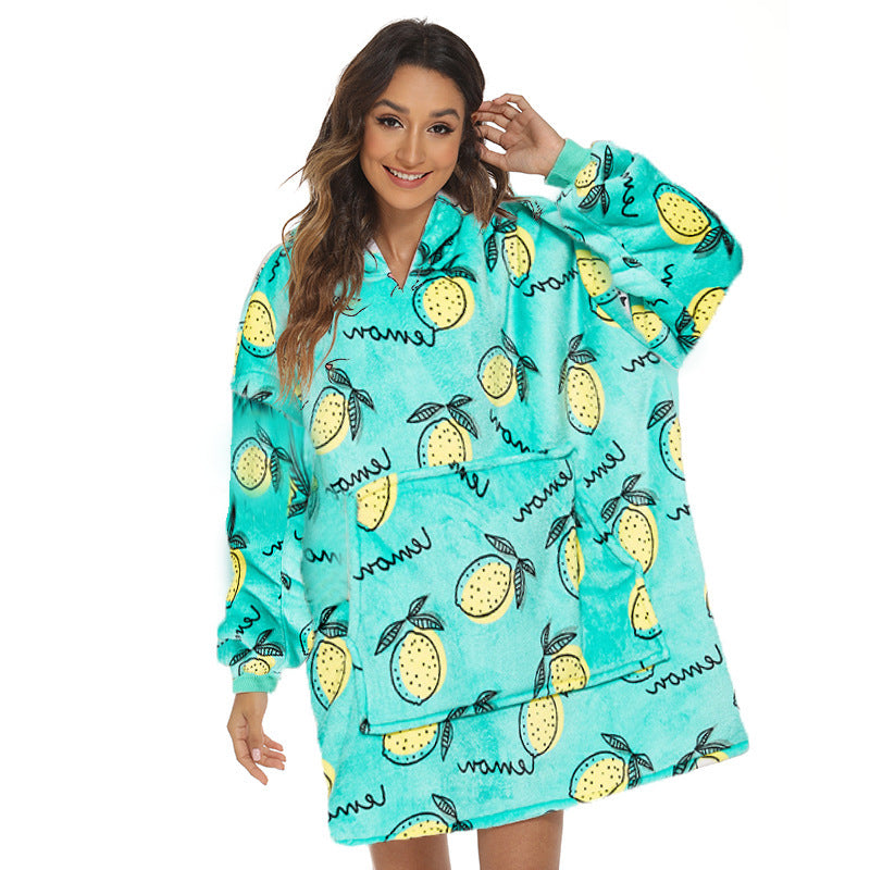 Person wearing oversized hooded blanket