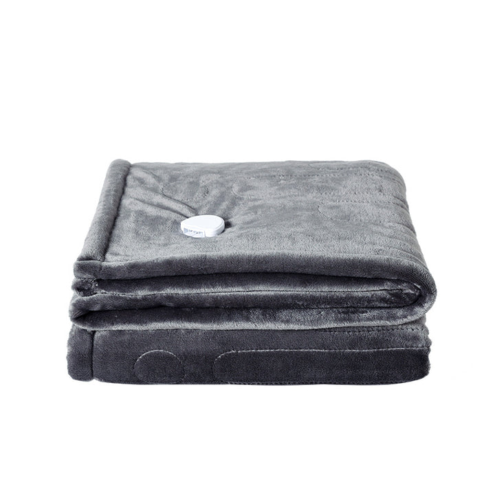 Electric heated flannel throw blanket on sofa