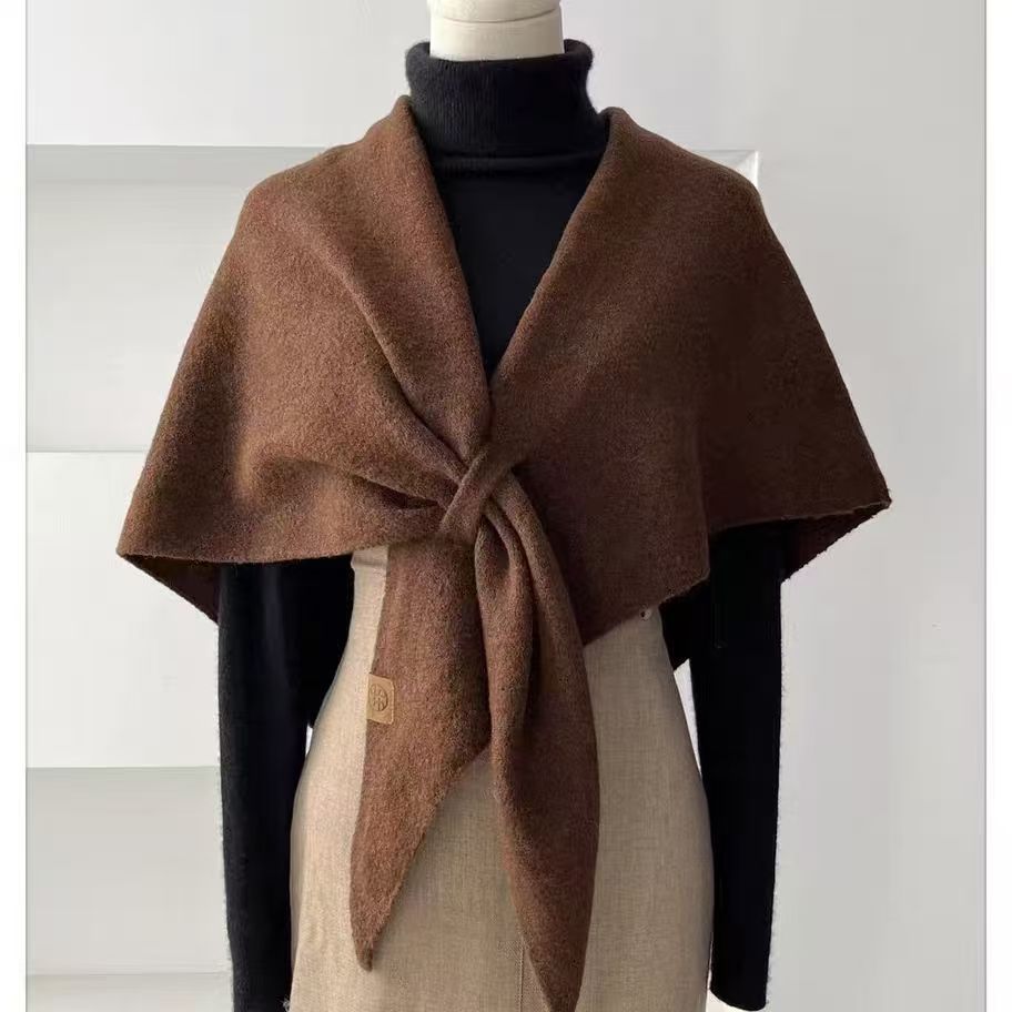 Woman wearing a wool triangle shawl