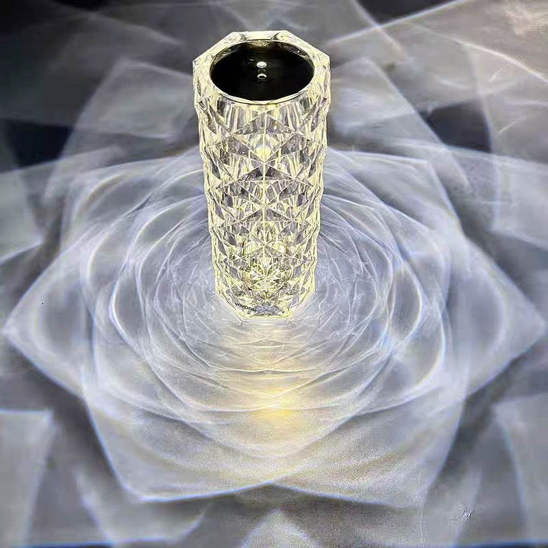 Crystal rose lamp projecting rose shadows