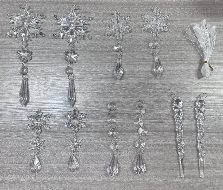 Clear acrylic icicle ornaments hanging on a Christmas tree