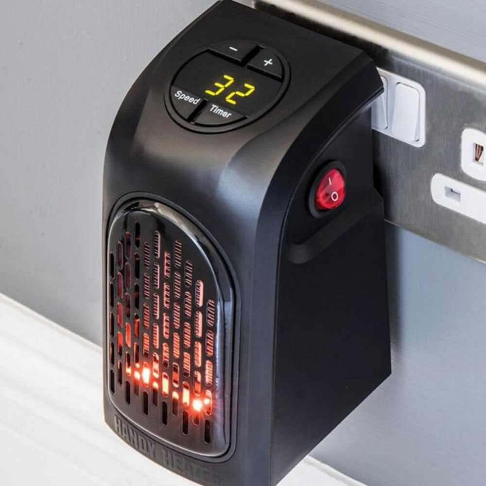 Small ceramic heater plugged into a wall outlet