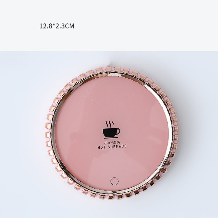 Mug on a round heated coaster with metallic rim