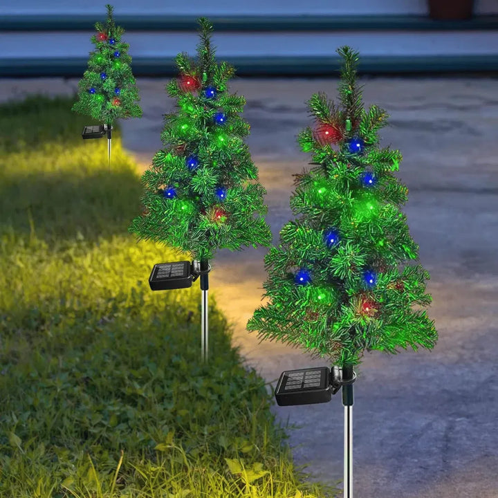 Solar Christmas tree stake lights on path
