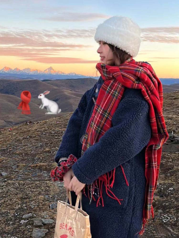 Woman wearing a red tartan scarf