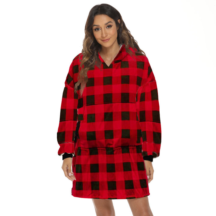 Person wearing oversized hooded blanket