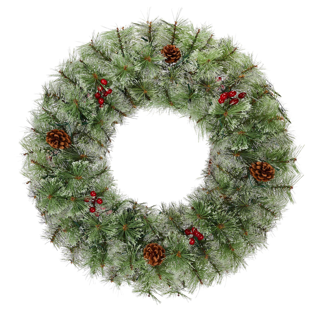 Two lit Christmas wreaths on a front door