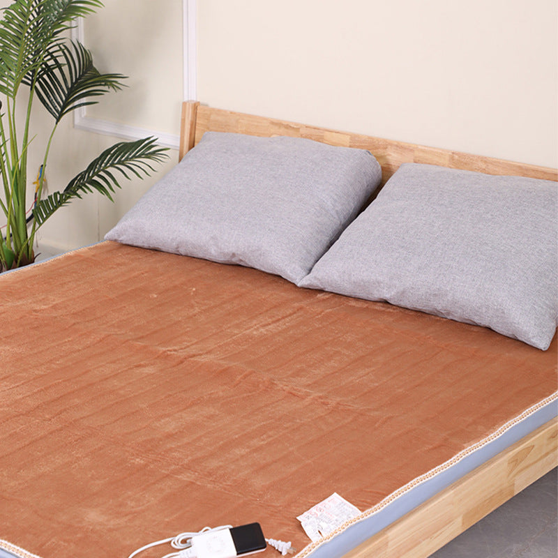 Flannel heated mattress pad on a bed