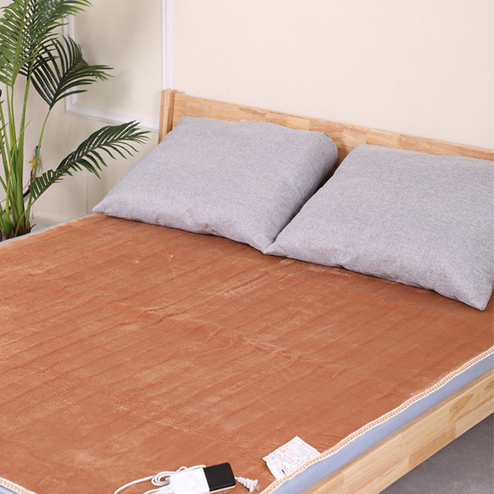 Flannel heated mattress pad on a bed